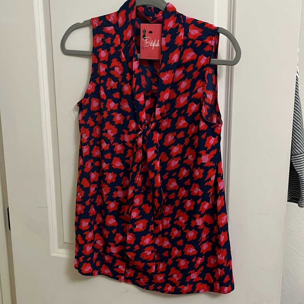 Sleeveless blouse perfect alone or with a jacket